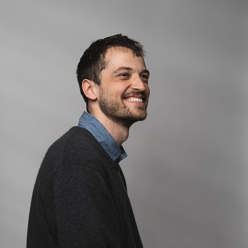 Headshot of Connor Slover with dark gray background