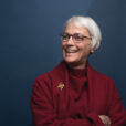 Headshot of Jean Carroon with blue background