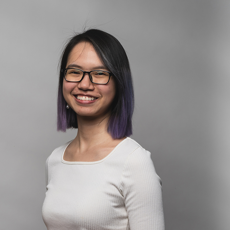 Headshot of An Hoang with dark gray background