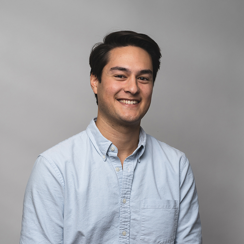 Headshot of Daniel Chen with dark gray background