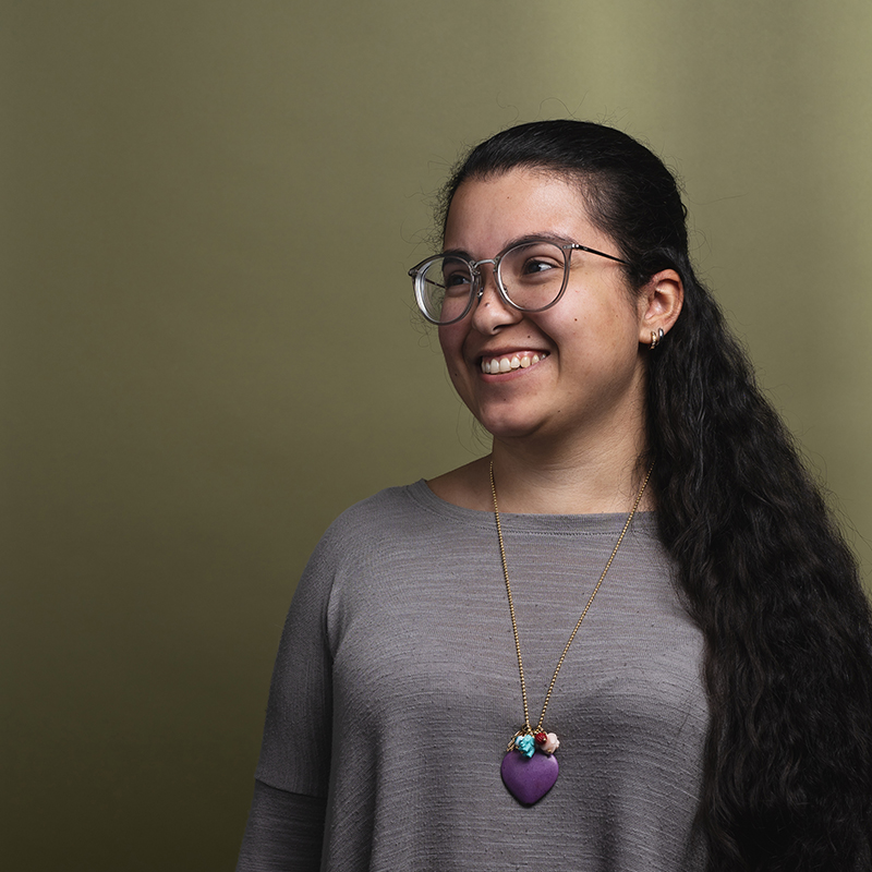 Headshot of Daniela Hernandez with green background