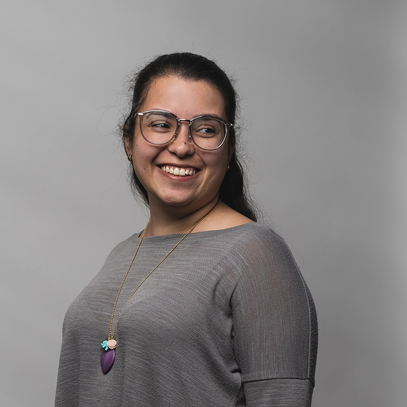 Headshot of Daniela Hernandez with dark gray background