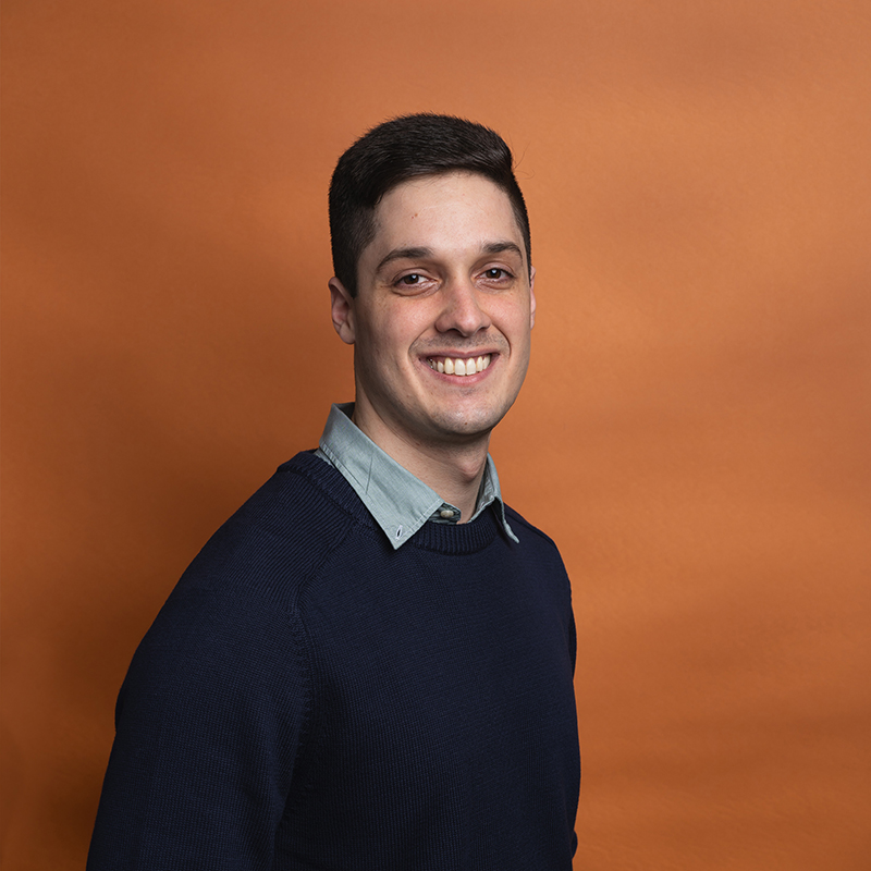 Headshot of Jaime Toro with orange background