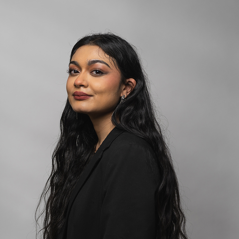 Headshot of Noor Shakeel with gray background