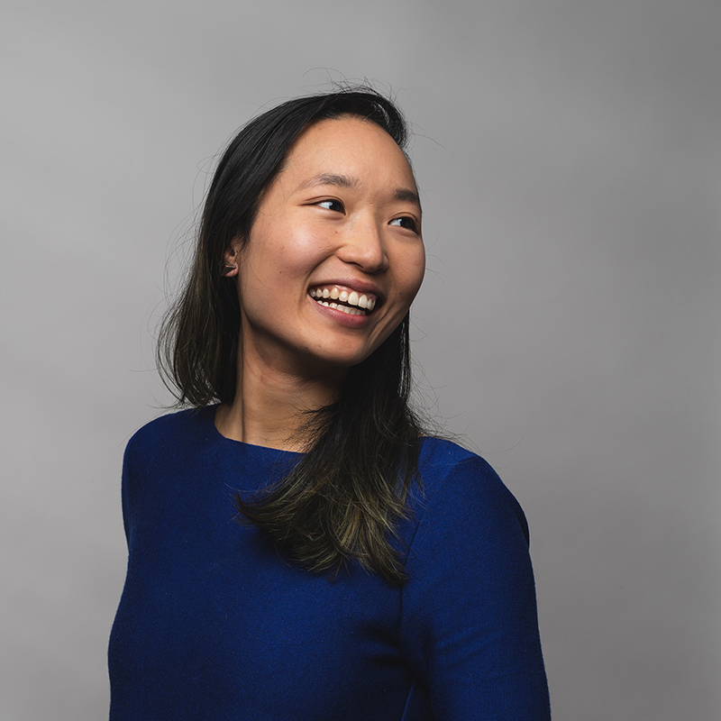 Headshot of Olivia Huang with gray background