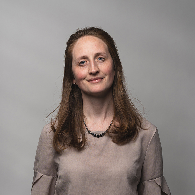 Headshot of Pamela Clemens with gray background