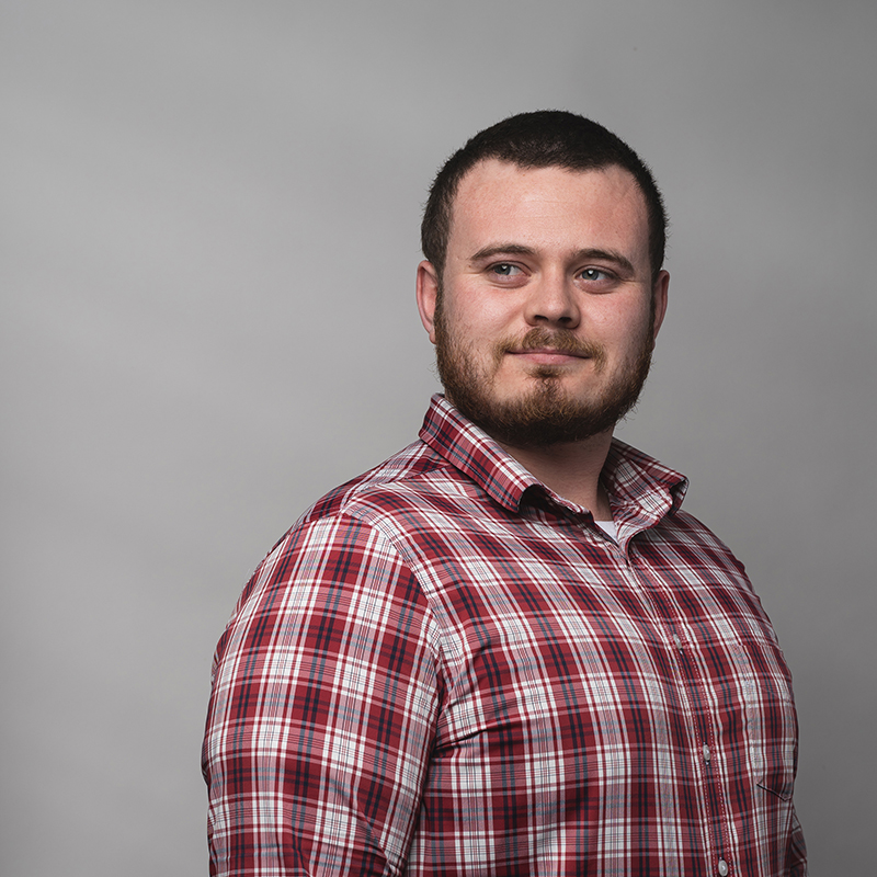 Headshot of Patrick O'Connor with gray background