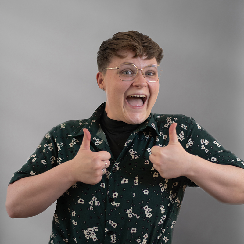 Headshot of Shannon Fay with gray background