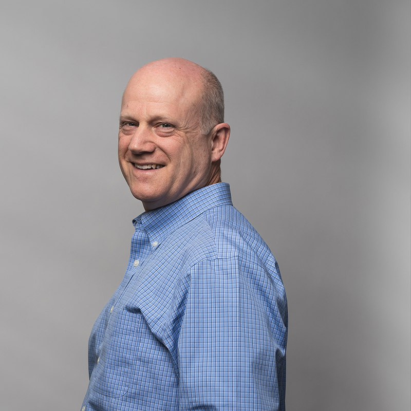 Headshot of Nick Weidemann with gray background